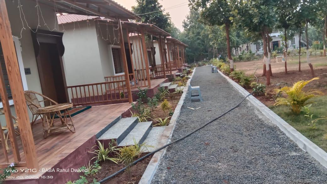 Luxury resort pool with palm trees at sunset